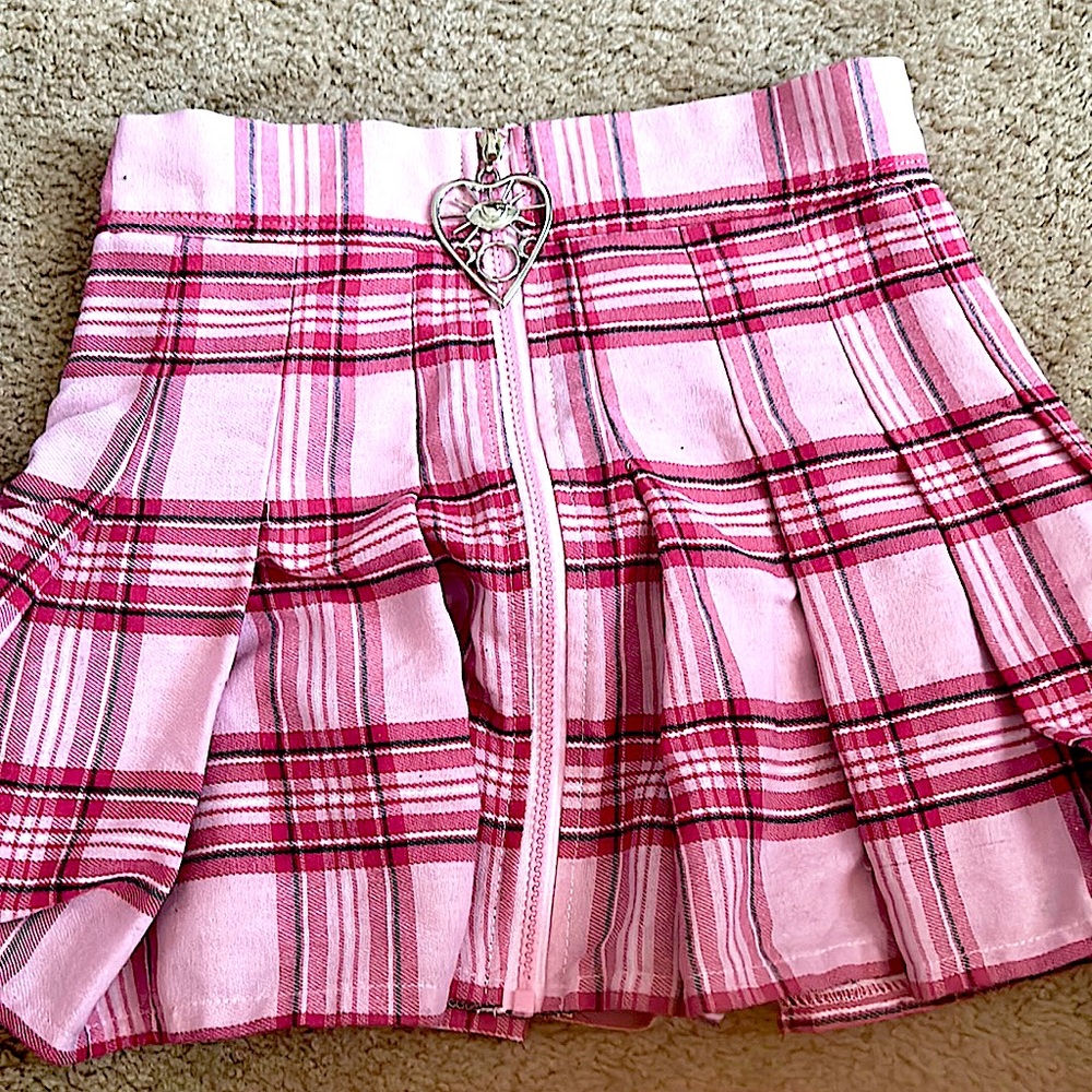 Pink Skirt from Spencers,Size:small-Medium,It zips in front w/Gothic eye symbol